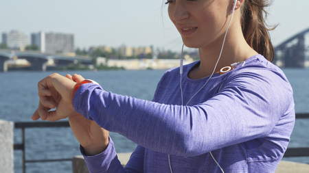 Woman uses her watches at the riverwalk