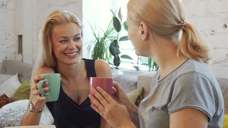 The two girls are drinking coffeeの写真素材