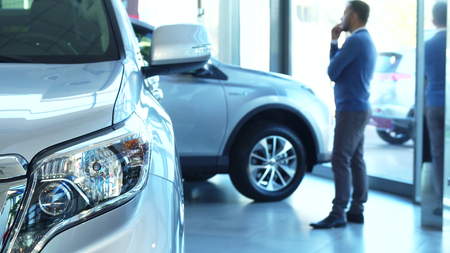 The business man thinks about buying a car