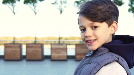 A cute boy examines the neighborhood through binocularsの写真素材