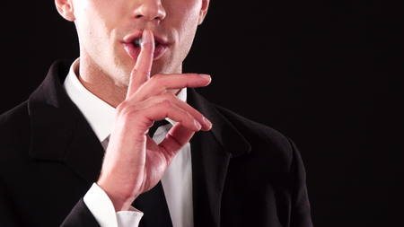 Close-up of the bottom of the face of a guy who asks for silence