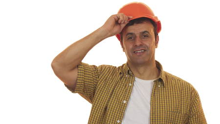 Handsome mature engineer wearing hardhat smiling confidently