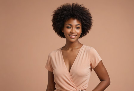 Elegant young woman smiling in a v-neck top. Her style is chic and her demeanor is friendly.の素材