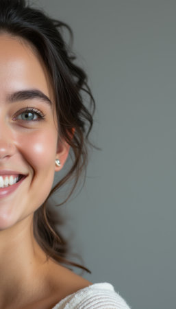 Radiant young woman smiling warmlyの素材