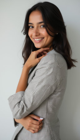 Confident woman smiling in stylish blazerの素材