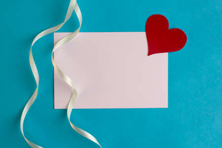 Love letter mockup. Greeting card with red heart space for text or design. Festive concept for Valentine or birthdayの写真素材