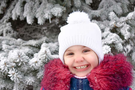 cute little girl smiling. winter. outside. High quality photoの写真素材