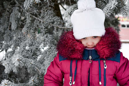 cute little girl is angry. winter. outside. High quality photoの写真素材