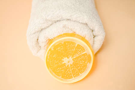 Closeup of hand made soap bar and towel on backround. Spa concept. Skin product mockup scene. Cosmetic product.の写真素材