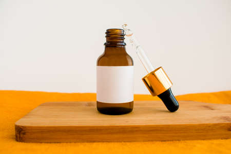 cosmetic dark amber glass bottles. closeup, copyspace. Beauty blogging, salon treatment concept, minimalism brand packaging mock up. mockap. high quality photoの写真素材