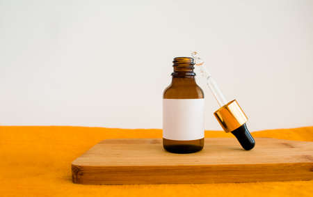 natural cosmetic skincare or essential oil bottles container on white background. Home made remedy and beauty product concept. mockup for designerの写真素材