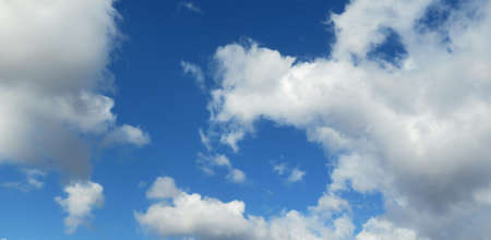 Panoramic view of blue sky with clouds, natural backgroundの写真素材