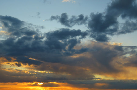 Beautiful sunset background with dark cloudsの写真素材