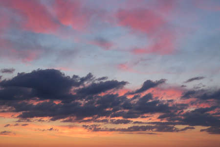 Beautiful sunset background with dark cloudsの写真素材