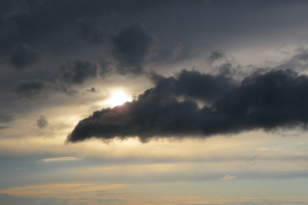 Beautiful sunset background with dark cloudsの写真素材