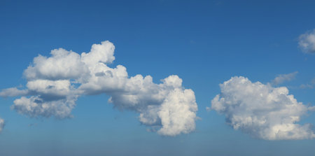 Beautiful fluffy clouds in blue sky background