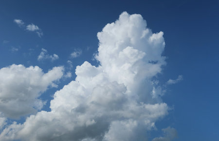 Big fluffy clouds in blue sky, natural sky backgroundの写真素材