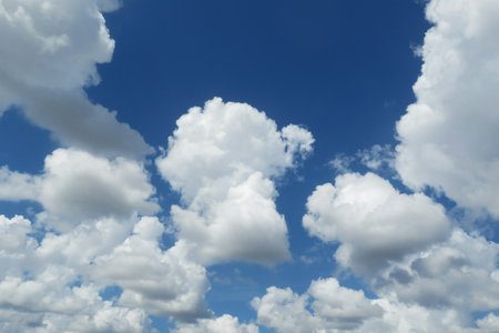 Beautiful fluffy clouds in blue skyの写真素材