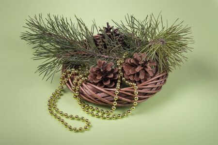 Christmas concept made of natural materials. Birch bark wreath with fir cones twigs and gold beadsの写真素材