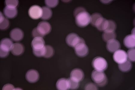 Pink Purple bokeh on dark background. Background bokeh highlightsの写真素材