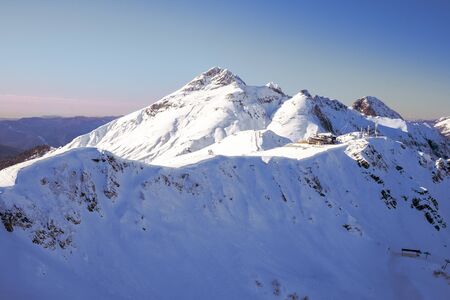 Mountain snowy peak against the blue sky.の写真素材