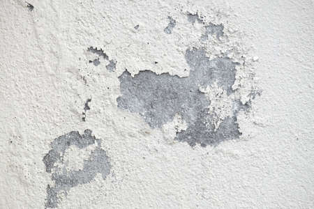 Old peeling plaster white wall textureの写真素材