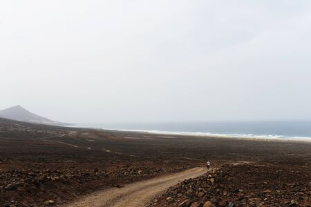 The picturesque and winding road of the Martian coast of Fuertoventura along the coast of the Atlantic oceanの写真素材