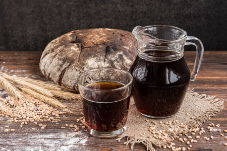 Dark bread kvass and rye bread and ears with grain/の写真素材