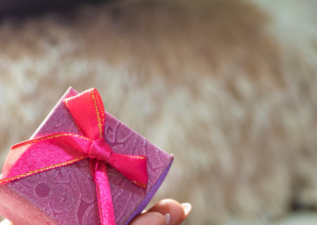 gift small pink box with a bow. festive packaging for jewelry.