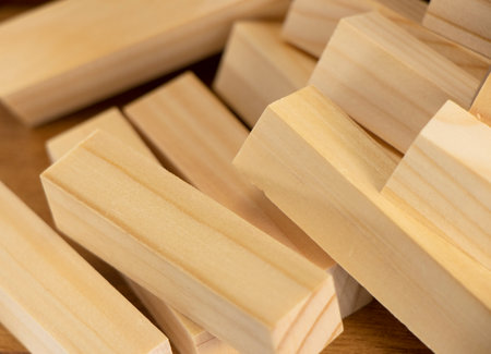 small wooden blocks stacked on. Wood texture, background. Jenga wooden planks