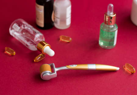 Dermaroller needle with serum in glass bottle. Anti wrinkle skin care.の写真素材