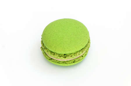 Green macaroon on white background. High definition photo in close up.の写真素材