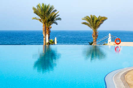 Outdoor tourism landscape. Luxurious beach resort with swimming pool