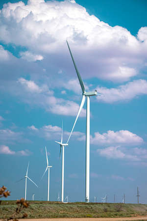 row of windmills against the sky. Wind turbines. Wind power plantの写真素材