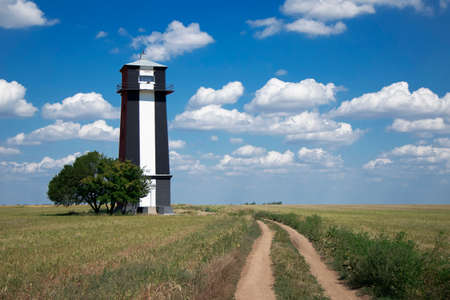 A lighthouse in the middle of a field. A bright sunny day. Kherson, Ukraineのeditorial素材