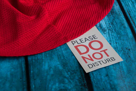 red-blue background with the inscription Please do not disturb. Contrast photoの写真素材