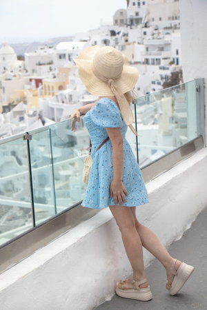 Europe travel vacation fun summer woman up happy in Oia, Santorini, Greeceの写真素材