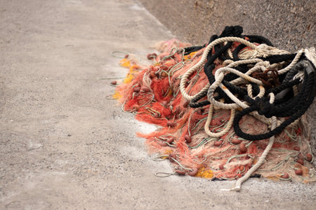 Bunch Old Fishing Nets Lies And Dries tangled together. With Fishing Buoys