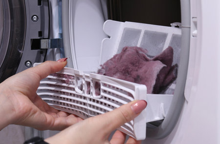 Front Load Tumble Laundry electric Dryer Machine. dirty air filterの写真素材