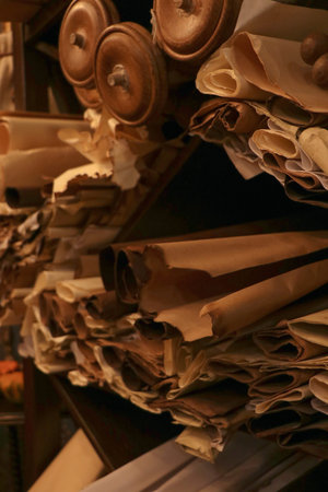 Old data sourse Rolled up stacks of unbound thick scrolls of ancient manuscriptsの写真素材