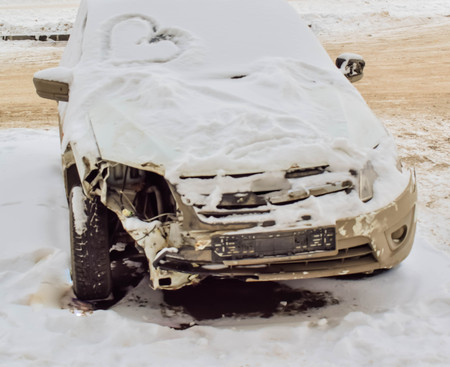 Car was covered with snow. Car in disrepair. He has long been in the parking lotの写真素材