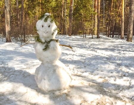 Spring came. Snowman is melting after Christmas. Holiday is over.の写真素材