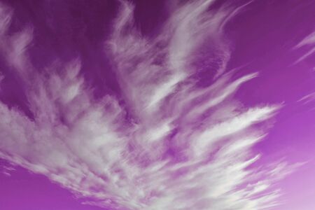 Most beautiful landscape of pink sky and white clouds. Pink sunset. The best natural sky clouds.の写真素材
