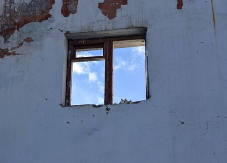 Destruction of the walls. Dismantling the building. Window on the old wall.の写真素材