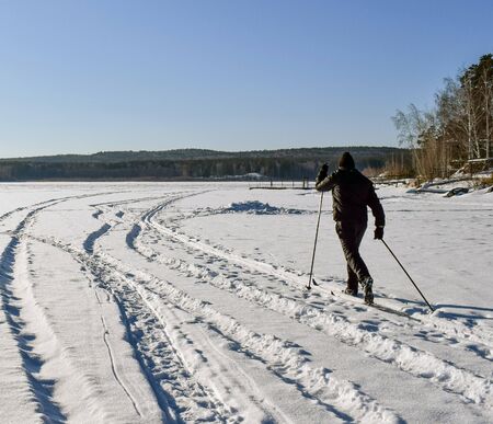 A skier is skiing on the lake. Winter sport.の写真素材