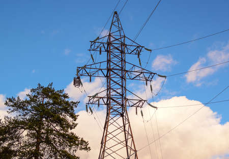 Power transmission tower against the sky. Electricity for transmission of power through electrical...