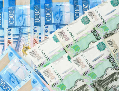 Money background. Russian currency. Banknote 2000 rubles. Banknote 1000 rubles. Financial crisis,...
