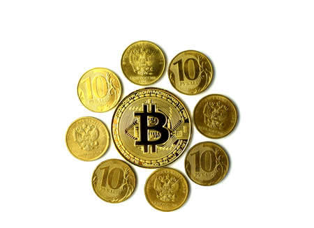 Gold bitcoin and gold metal coins isolated on white background. Cryptocurrency, digital money. Flat lay. Top view.の写真素材