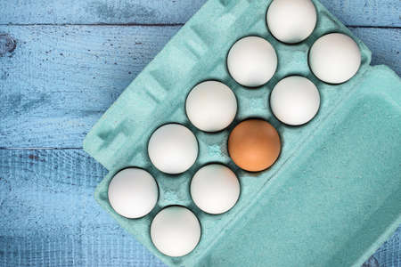 Chicken eggs in a colored cardboard box. Purchase and storage of eggs. An ingredient for a healthy...