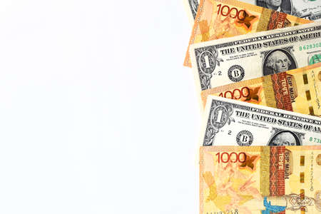 Banknotes of the USA and Kazakhstan isolated on a white background. Currency exchange concept. International financial relations. Money background. Selective focus. Copy space.の写真素材